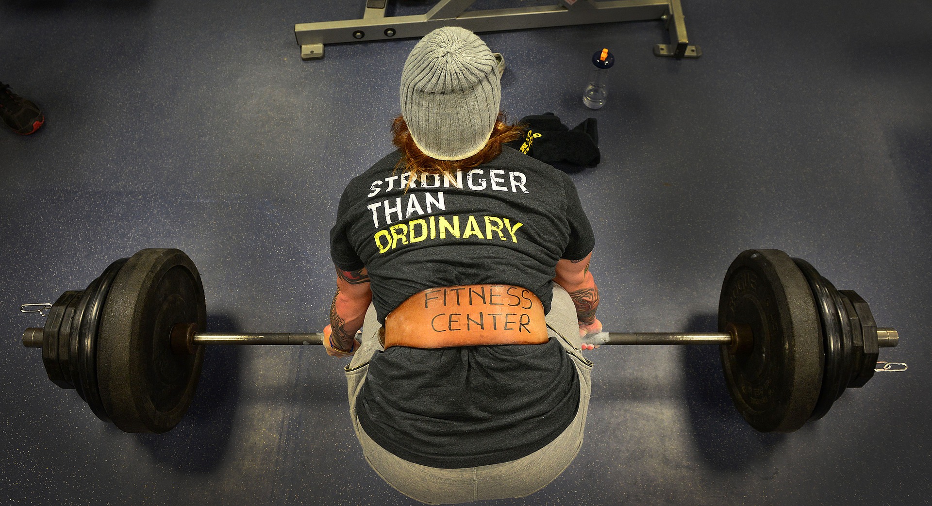 tattooed man powerlifting weights 5 ways transform body and mind ideal summer body holistic benefits